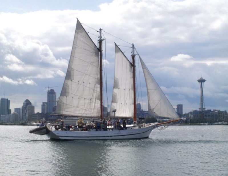 Historic schooner Lavengro under full white sails on the water