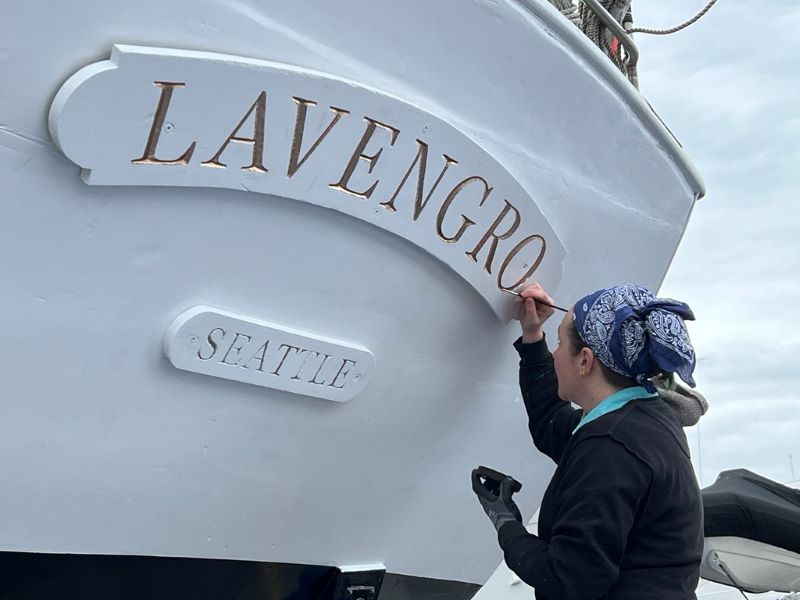 Close-up of the schooner Lavengro’s name on the wooden transom